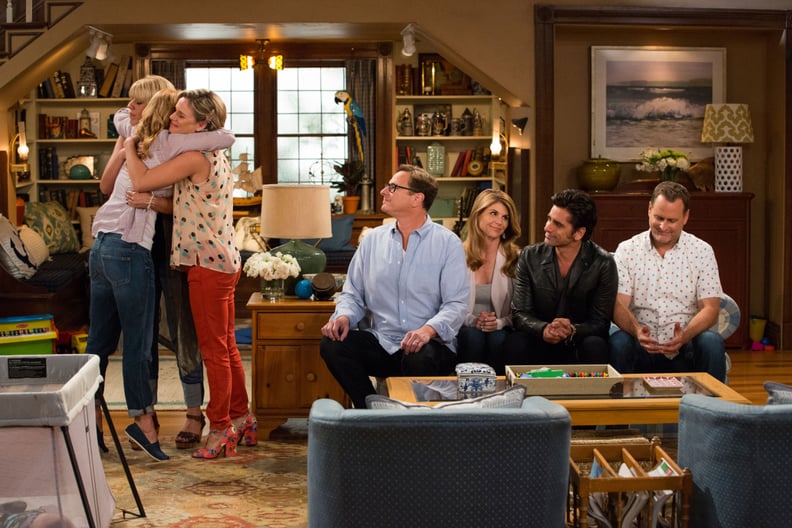 FULLER HOUSE, l-r: Jodie Sweetin, Candace Cameron Bure (back to camera), Andrea Barber, Bob Saget, Lori Loughlin, John Stamos, Dave Coulier in 'Our Very First Show, Again' (Season 1, Episode 1, aired February 26, 2016). ph: Michael Yarish/Netflix/courtesy