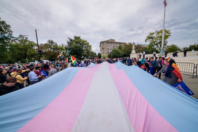 WASHINGTON DC, UNITED STATES - 2019/10/08: A giant Trans Flag unfurled outside the Supreme Court. 133 protesters were arrested blocking the street across the Supreme Court in an act of non violent civil disobedience, as hundreds of LGBTQ+ advocates conven