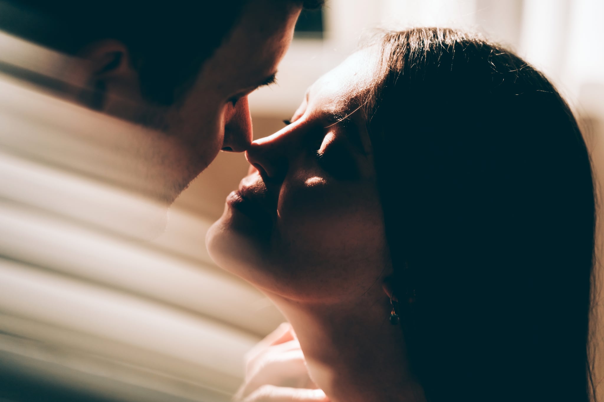 A young couple in love, shot in silhouette