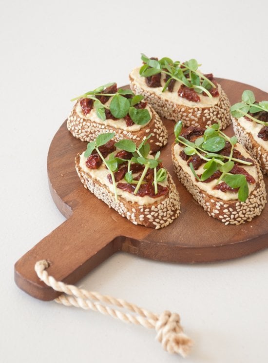 Appetizer: Hummus, Sun-Dried Tomato, and Pea Shoot Crostinis