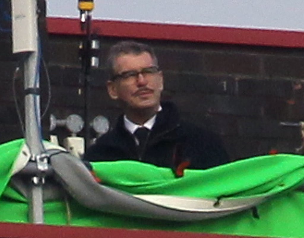 Pierce Brosnan sported a mustache and glasses on the set of his new thriller, Survivor, in London on Monday.