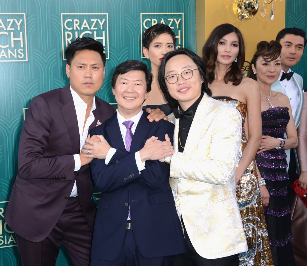 Pictured: Jon M. Chu, Ken Jeong, Jimmy O Yang, Sonoya Mizuno, Gemma Chan, Michelle Yeoh, and Henry Golding