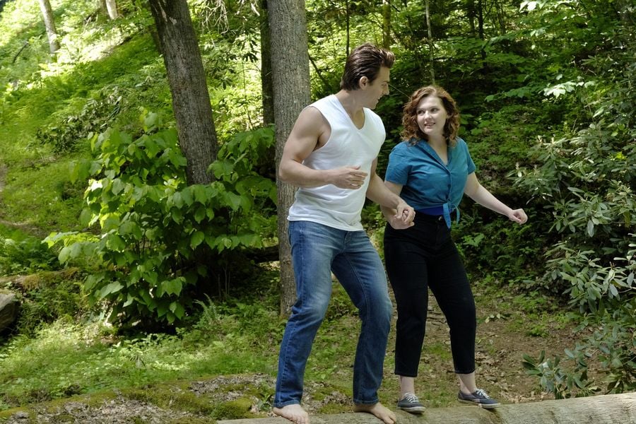 Here she is being dwarfed by Colt Prattes's biceps.