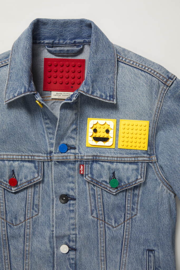 In a collaboration we never saw coming, Levi's and Lego (yes, you read that right) have teamed up to create a nostalgic collection full of "wearable art." The new limited-edition line features Levi's signature staples — like trucker jackets and straight jeans — but takes them to the next level with a playful twist: customizable Legos! The popular denim brand's classics are adorned with flexible baseplates that you can actually snap Lego tiles onto to pull together your own unique piece — or you can let the cool designs speak for themselves.
In addition to the denim, the upcoming Lego x Levi's collection also includes hoodies, bags, hats, and even a cargo vest, all featuring fun Lego-inspired details like colorful buttons and a bright-red Lego patch swapped in instead of Levi's traditional leather version. "This is such a fun collaboration celebrating self-expression, creativity and nostalgia," Karyn Hillman, chief product officer for Levi Strauss & Co., said in a press release. "With the customizable baseplates, Levi's is now literally a new blank canvas for Lego play."
The line will be available starting Oct. 1 on Levi's website and in select Levi's stores, and every customizable purchase comes with a bag of 110 Lego Dots, which will allow you to accessorize your pieces and bring out your inner child. Check out the new Lego x Levi's collaboration ahead.

    Related:

            
            
                                    
                            

            Sofia Richie&apos;s Kappa x Juicy Couture Capsule Collection Is So 2000s, I Can Feel the Nostalgia