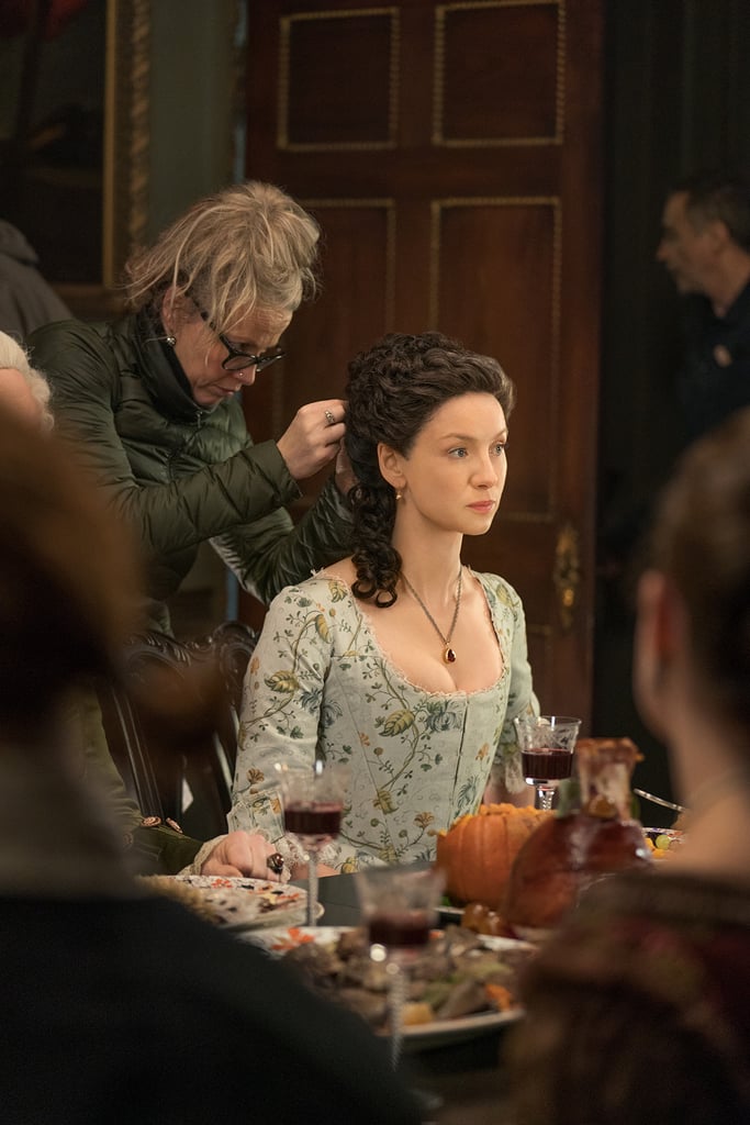 Balfe gets her intricate updo styled in between takes during a season four scene that sees Claire eating dinner with some of her new American acquaintances.