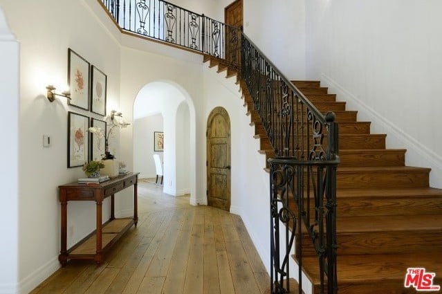 Even the staircase's iron railing oozes charm and beauty!