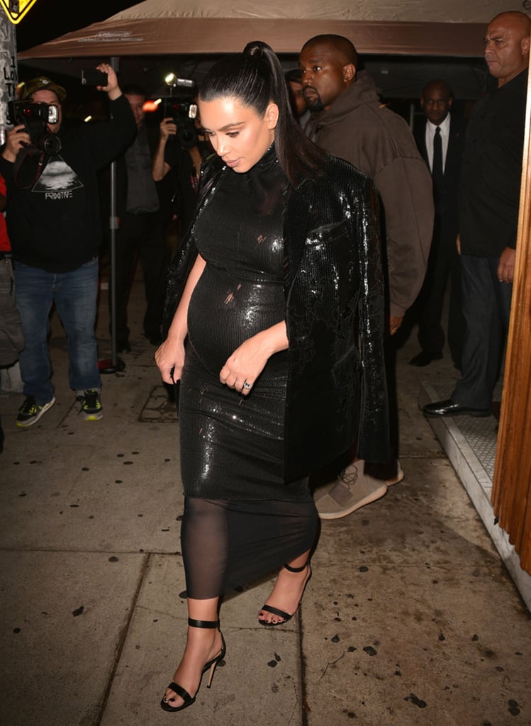 Kim styled the bump in body-conscious black.