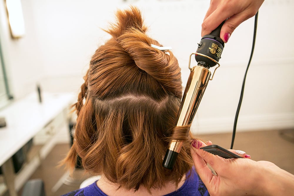 When adding waves, Huffnagle likes to separate the hair into three horizontal sections, starting with the bottom section first. You can use a clampless iron to create casual waves or a regular curling iron for a more polished look.