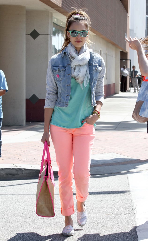 Jessica went back to the '80s, wearing a Jet by John Eshaya sweatshirt-sleeved denim jacket with coral J Brand jeans, a high ponytail, and turquoise shades in LA.