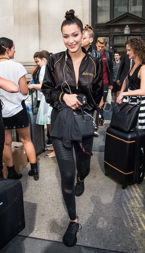Accessorize leggings and sneakers with stylish add-ons like a luxe bag and bomber, à la Bella.