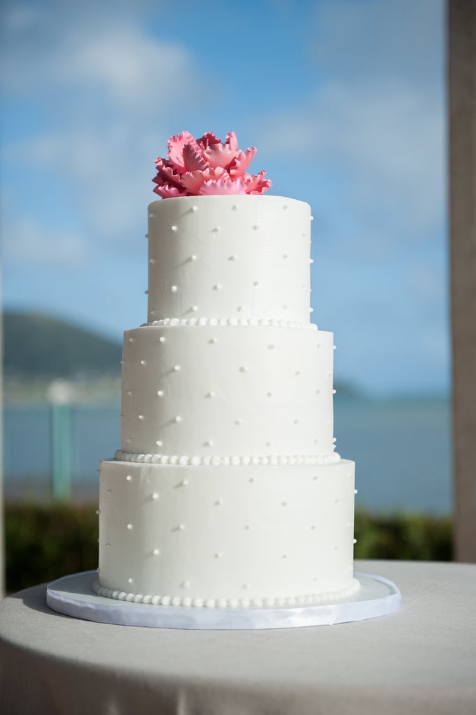 The details on this classic wedding cake are both soft and intricate at the same time — the delicate piping and smooth fondant look almost too sweet to eat.