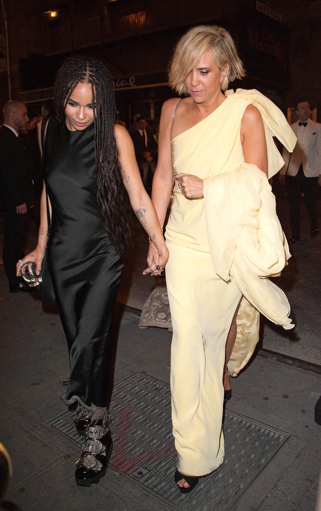 Zoë Kravitz held hands with Kristen Wiig as they made a glamorous afterparty arrival together.