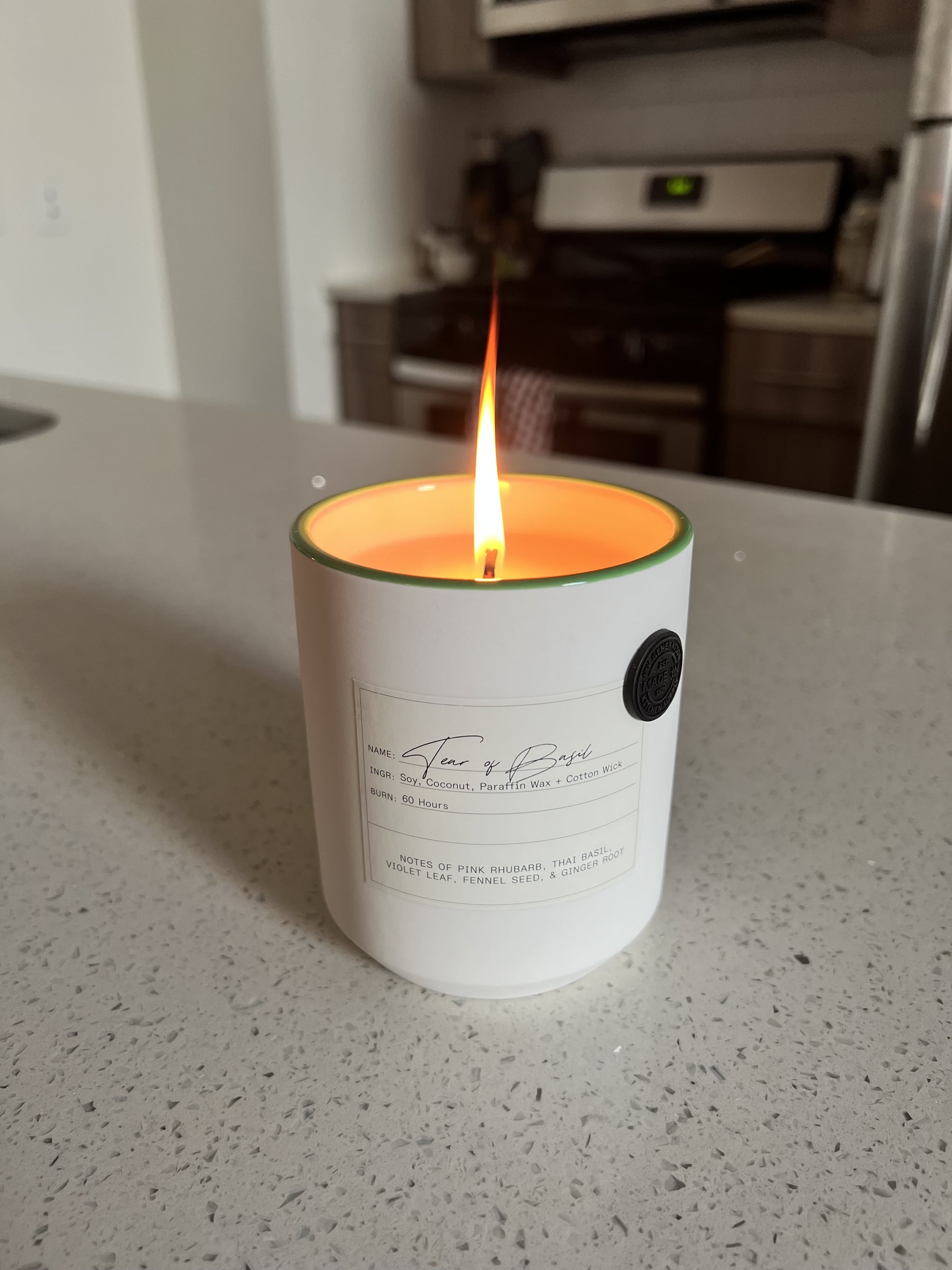 Made In Kitchen Candle in Tear of Basil on kitchen countertop.