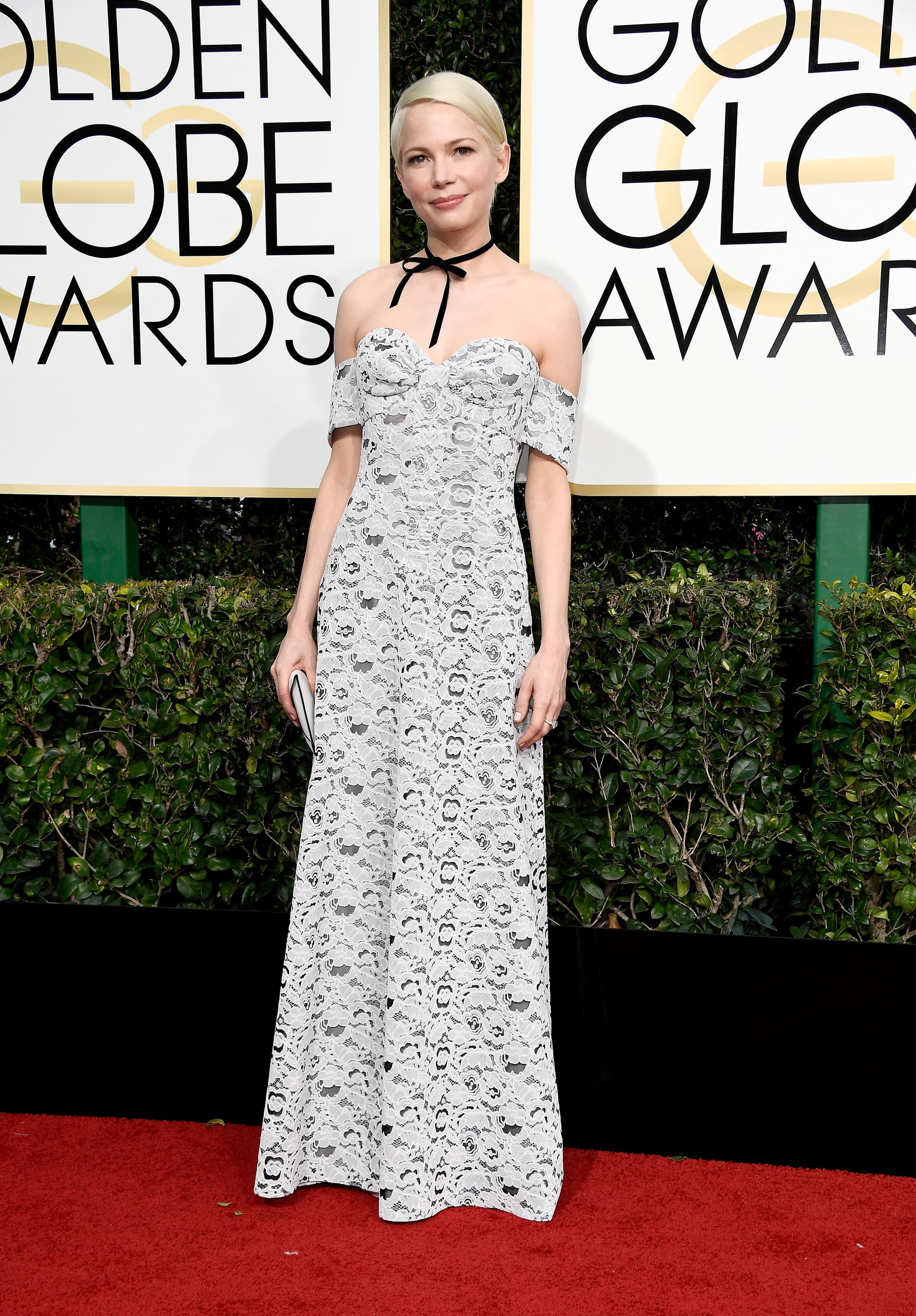 Michelle Williams in a Louis Vuitton dress with a bow choker in 2017., 110  Golden Globes Dresses We're Still Dreaming About