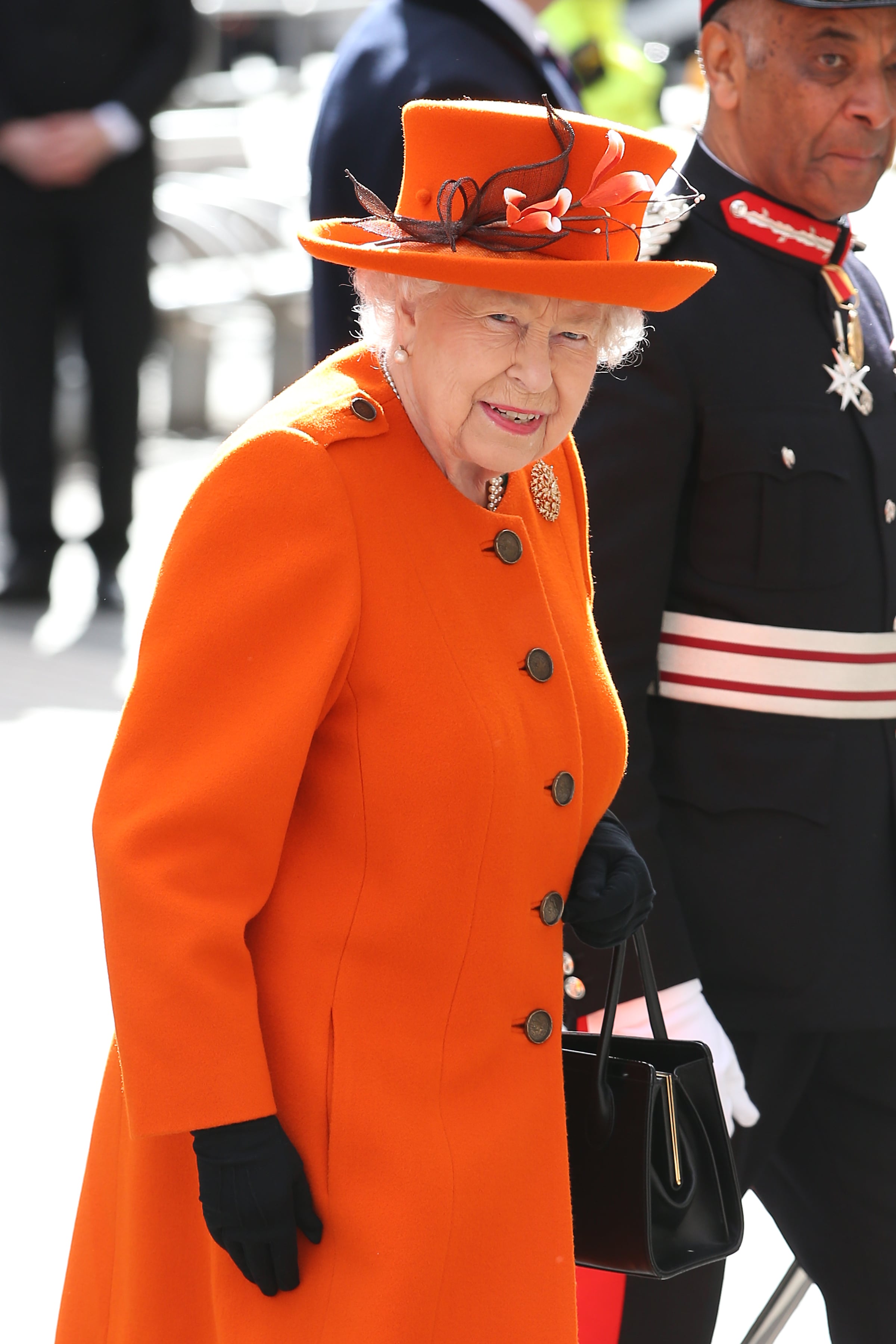 queen elizabeth orange dress Queen Elizabeth's Best Orange Outfits [PHOTOS]
