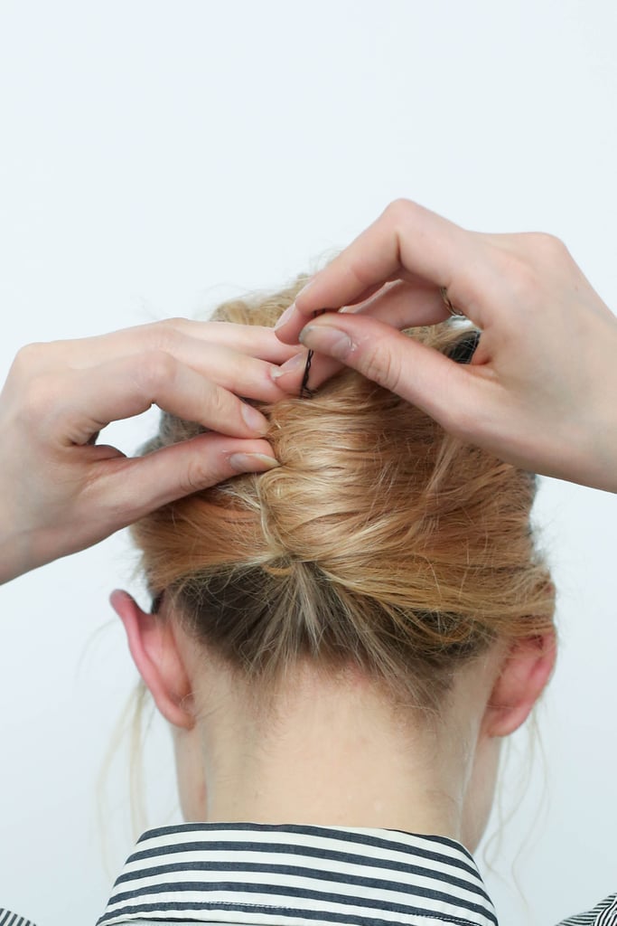 On the left-hand side of your twist, slide in several bobby pins, making sure that it's secure.
