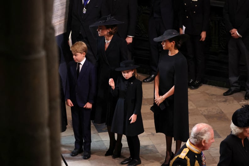 LONDON, ENGLAND - SEPTEMBER 19: King Charles III and Camilla, Queen Consort, Catherine, Princess of Wales, Meghan, Duchess of Sussex, Prince George and Princess Charlotte arrive at the State Funeral of Queen Elizabeth II, held at Westminster Abbey on Sept