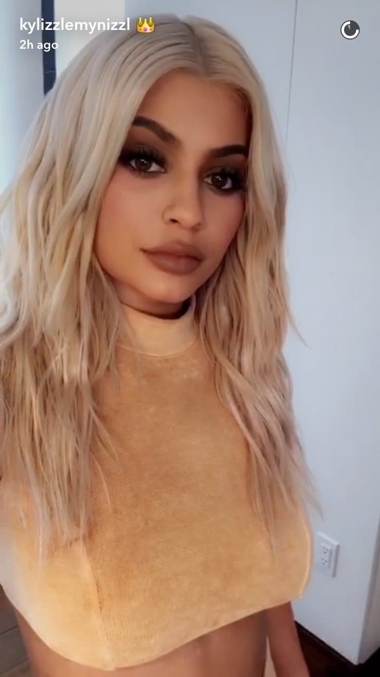 While Kylie Snapped Her Revealing Top