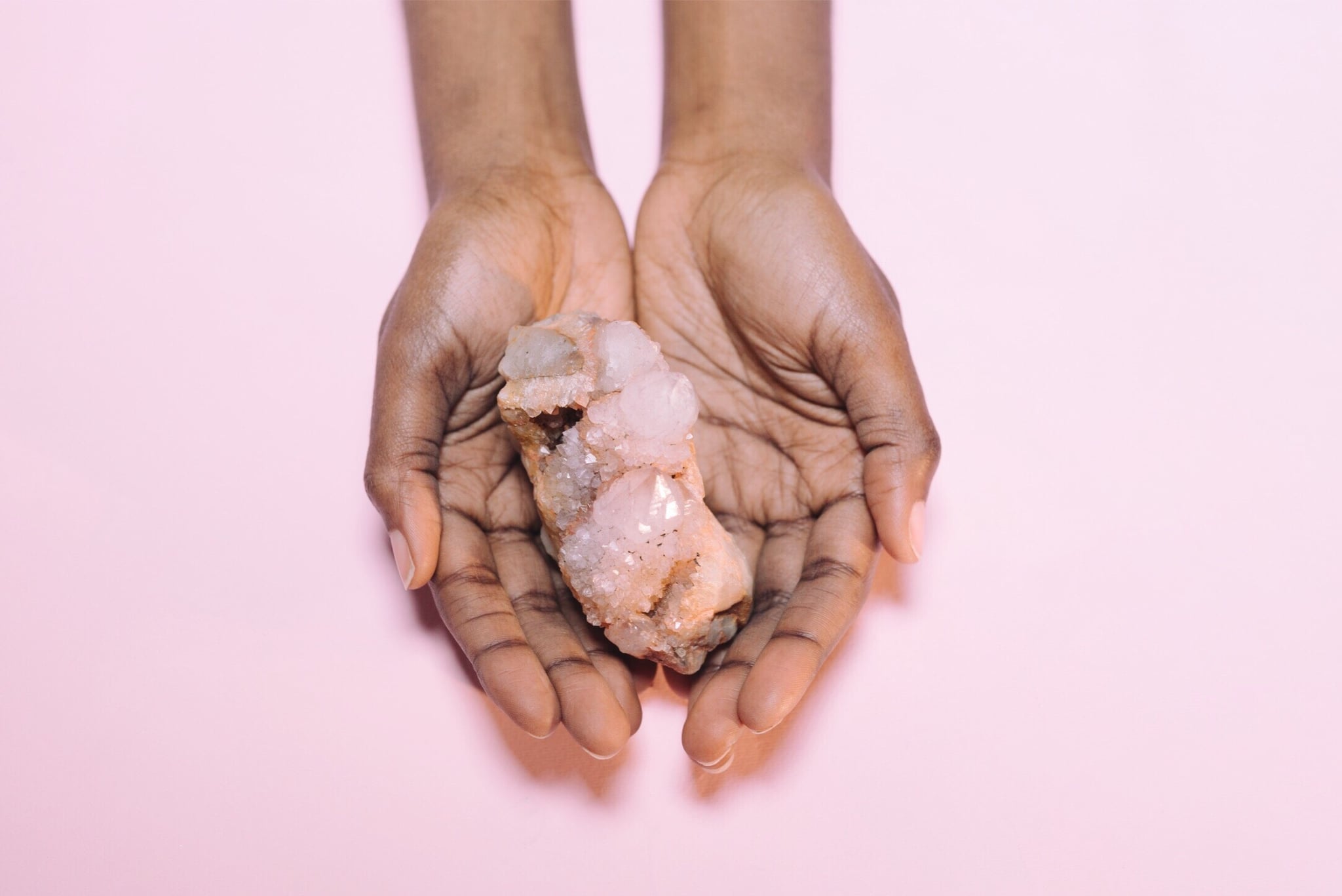 woman holding a crystal as an energy healing tool