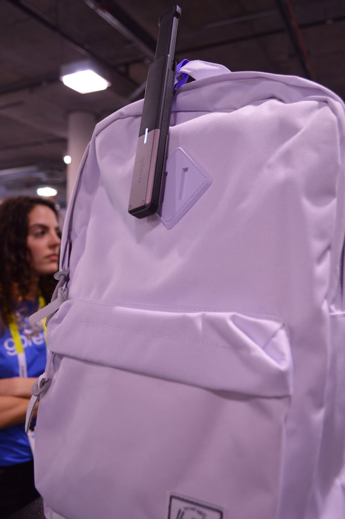You can clip it onto a backpack like this.