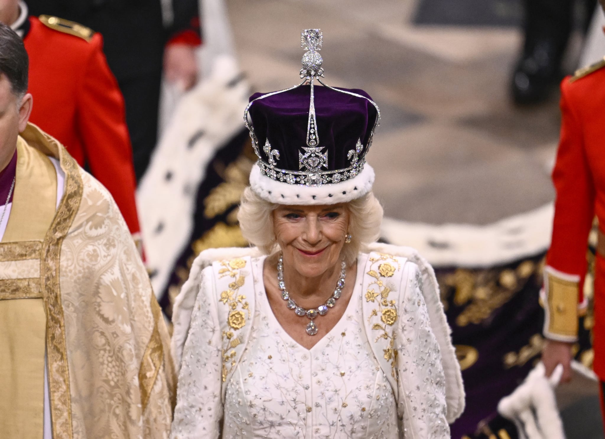 LONDON, ENGLAND - MAY 06: Queen Camilla departs the Coronation service of King Charles III and Queen Camilla at Westminster Abbey on May 06, 2023 in London, England. The Coronation of Charles III and his wife, Camilla, as King and Queen of the United Kingdom of Great Britain and Northern Ireland, and the other Commonwealth realms takes place at Westminster Abbey today. Charles acceded to the throne on 8 September 2022, upon the death of his mother, Elizabeth II. (Photo by Gareth Cattermole/Getty Images)