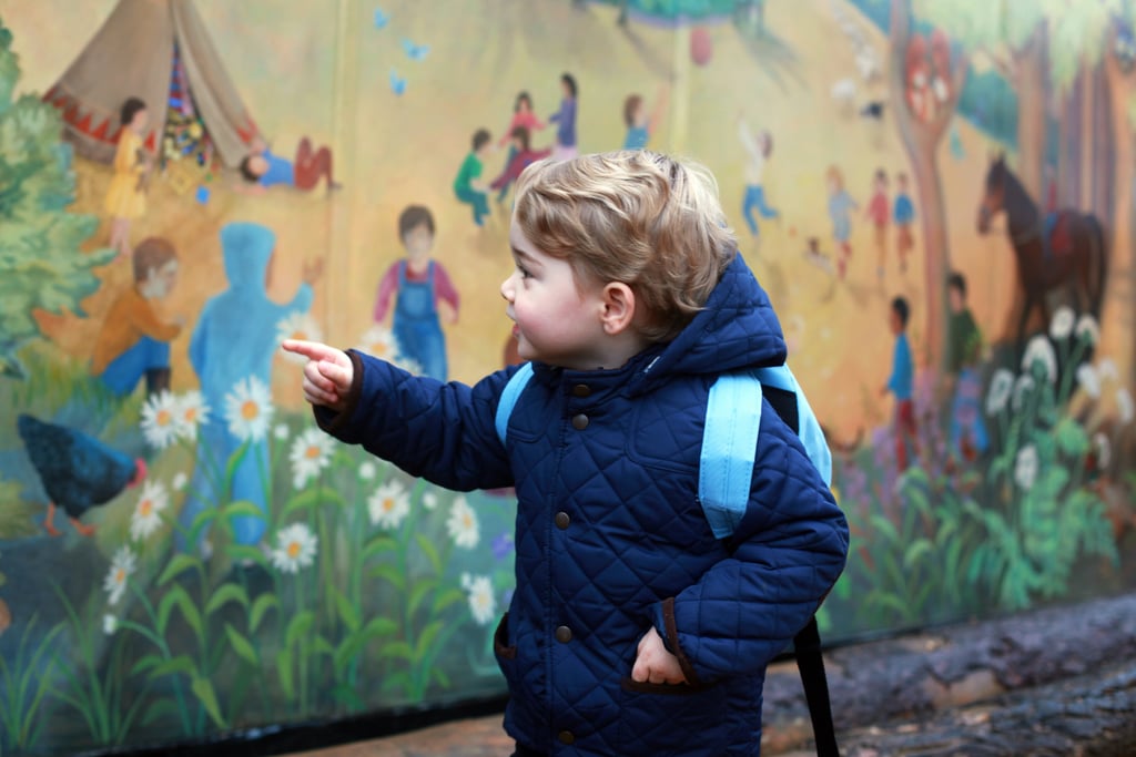 In a second shot of Prince George's first day experience, he's enamored with the school's mural, located near Sandringham in Norfolk.