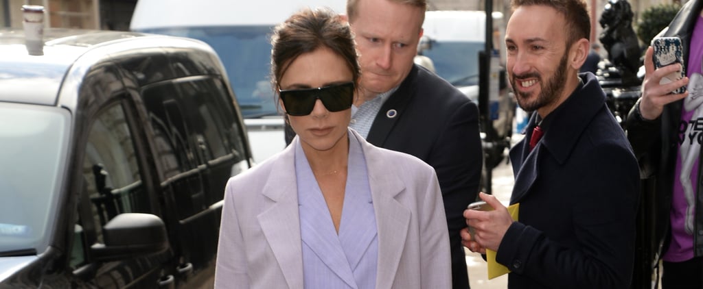Victoria Beckham Wearing a Purple Suit