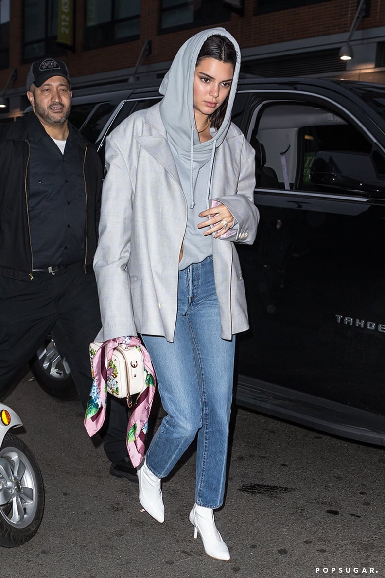 She Styled It With a Pair of White Boots and a Mini Dolce & Gabbana Purse
