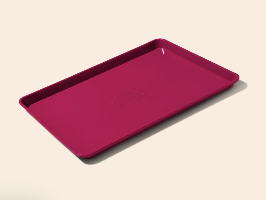 Great Jones Holy Baking Sheet ($45)
Every household should have a great baking sheet on hand for when they need to whip up flavorful, oven-ready treats in an instant, and this baking sheet is considered one of the very best. Whether you're baking a large batch of cookies or are playing around with new, sheet-pan dinners, this tool can accommodate it all. Plus, one PS editor even went as far as calling it her "new favorite kitchen product" in this Great Jones Holy Sheet Pan review.
Editor Quote: "It's sturdy and a smidge heavier than other options in my cabinets, which means it has yet to show any signs of damage, despite being stored alongside wire racks. Plus, the bottom doesn't puff up when baking in high heat unlike some flimsier options out there. And if you've ever had to scrape burnt pieces off a new pan, rest assured the nonstick coating on the Holy Sheet pan is impressively slick, even after handwashing it several times." — Lisa Robinson, former distribution director