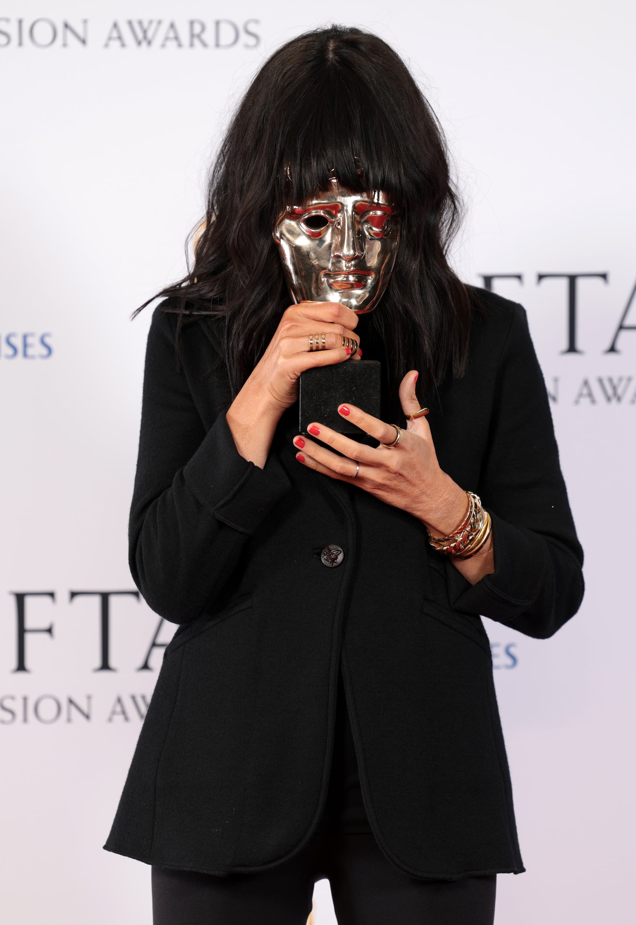 LONDON, ENGLAND - MAY 14: Claudia Winkleman with the award for Entertainment Performance  for 'The Traitors' during the 2023 BAFTA Television Awards with P&O Cruises at The Royal Festival Hall on May 14, 2023 in London, England. (Photo by Shane Anthony Sinclair/BAFTA/Getty Images for BAFTA)