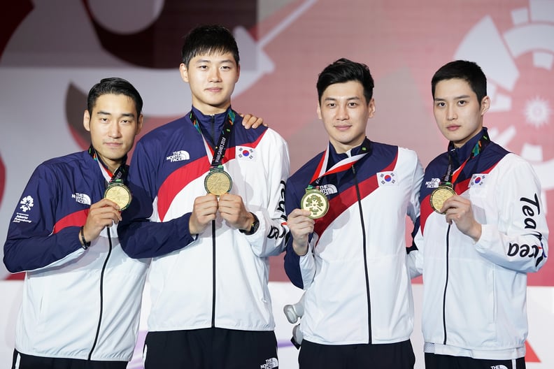 JAKARTA, INDONESIA - AUGUST 23:  Sanguk Oh;  Bongil Gu; Junho Kim and Bongil Gu of Korea pose on the podium during the awards ceremony in Fencing Men's team foil final match on day five of the Asian Games on August 23, 2018 in Jakarta, Indonesia.  (Photo 