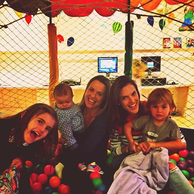 Alessandra Ambrosio celebrated the holiday in a ball pit with a friend and their adorable kids.