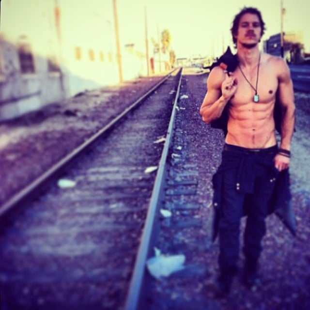 And when he's standing near some train tracks.