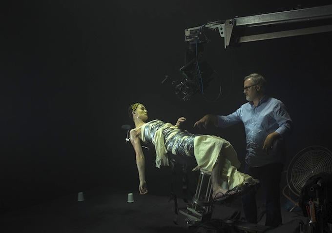 This behind-the-scenes shot shows director Fincher tending to Pike as Amy.