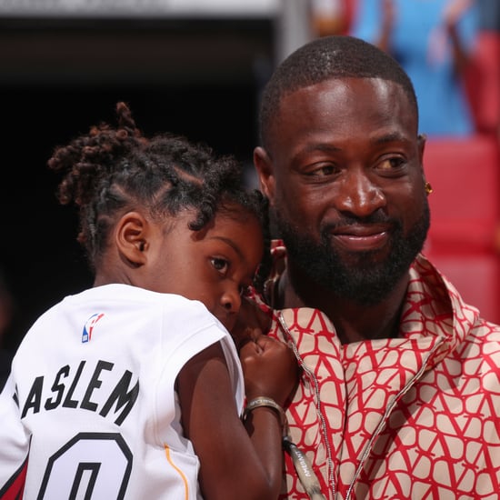 Dwyane Wade, Gabrielle Union, and Kaavia at Miami Heat Game