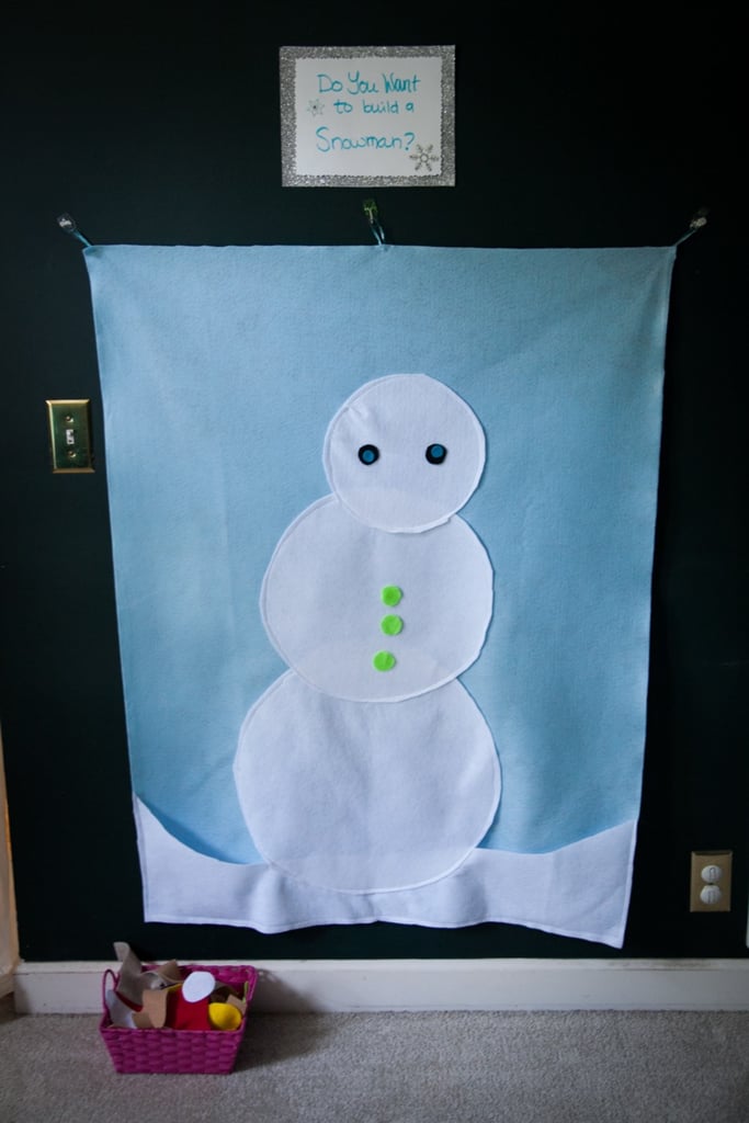 Another toddler-appropriate game choice at this fun birthday bash was the "Do You Want to Build a Snowman?" felt wall arrangement game. The kids had such a splendid time giving the snowman different hats, scarves, and noses during the party.