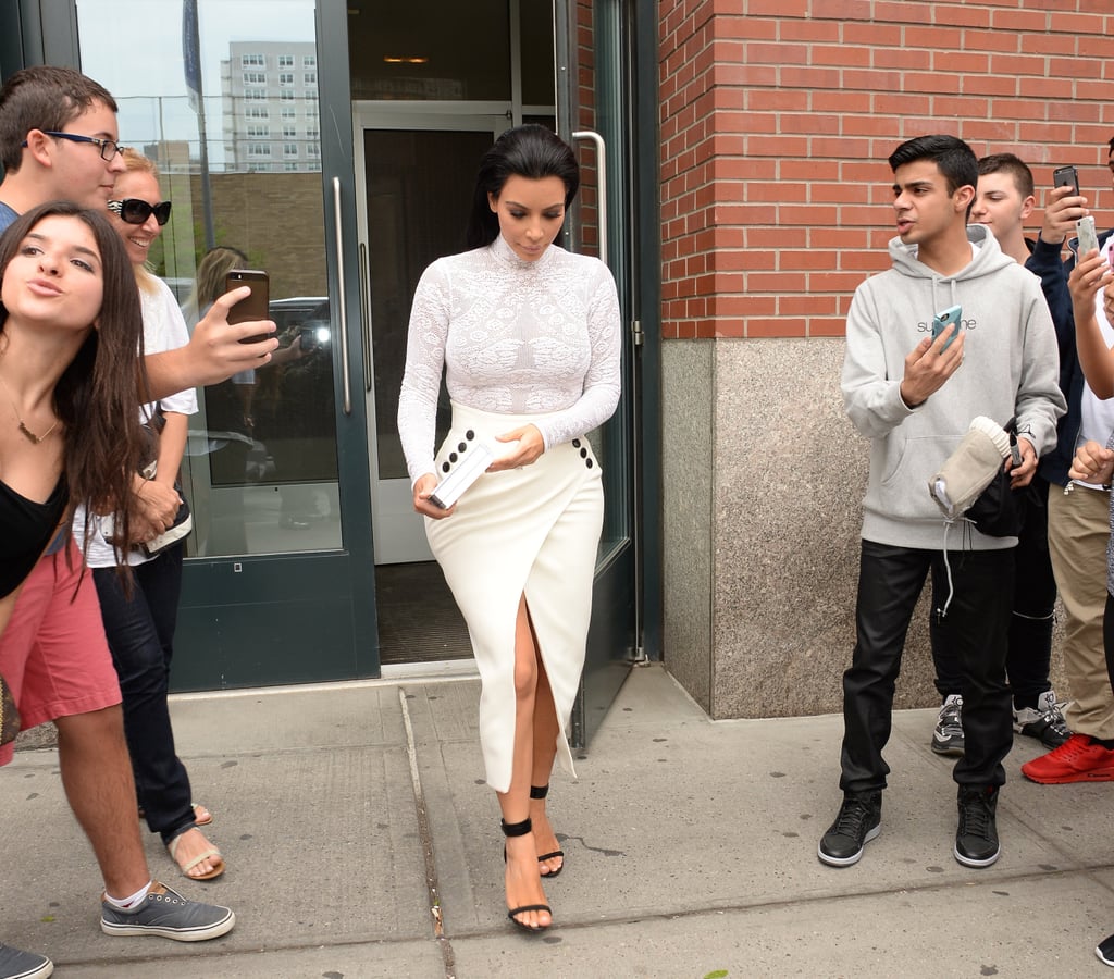 Kim completed her Dior embroidered mesh turtleneck and cream button-front midi skirt with black sandals when she headed out to sign copies of her book Selfish.