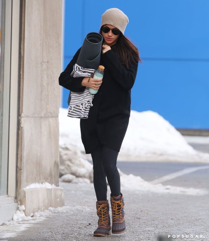 Meghan wore her trusty boots on her way back from yoga in Dec. 2016.