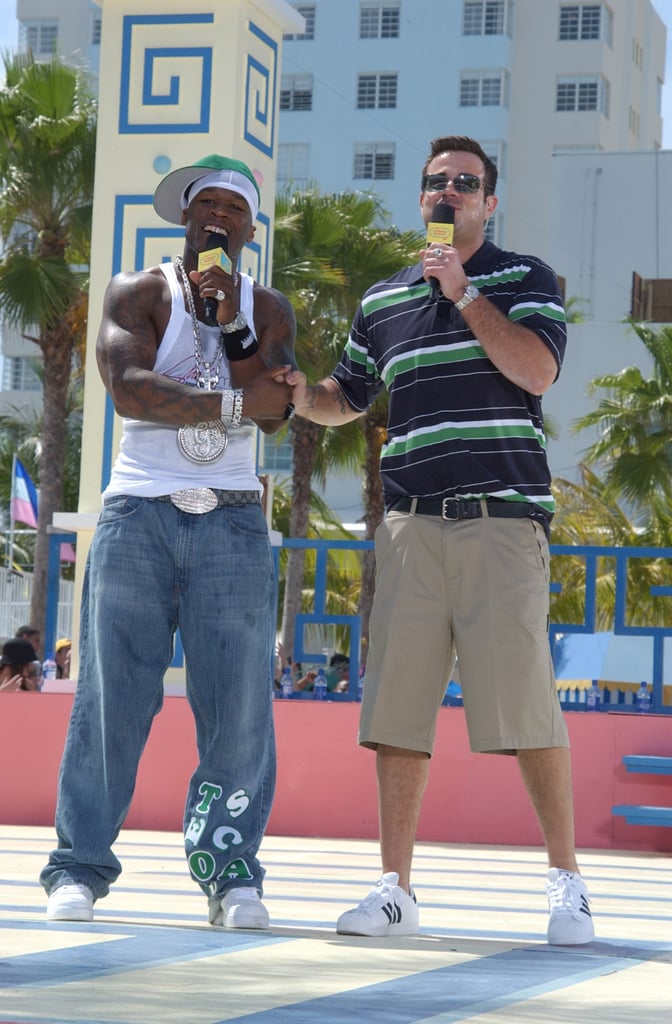 2003: Carson Daly and 50 Cent color coordinate their outfits and share a sweet bro handshake in Miami.