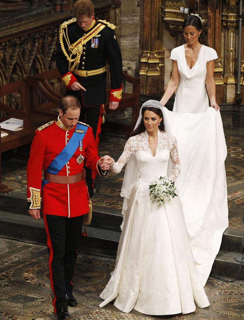 They sweetly held hands while making their way from the altar at their April 2011 wedding.