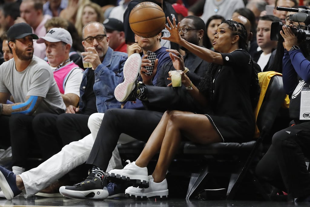 Gabrielle Union and Dwyane Wade Dodge Basketball at NBA Game