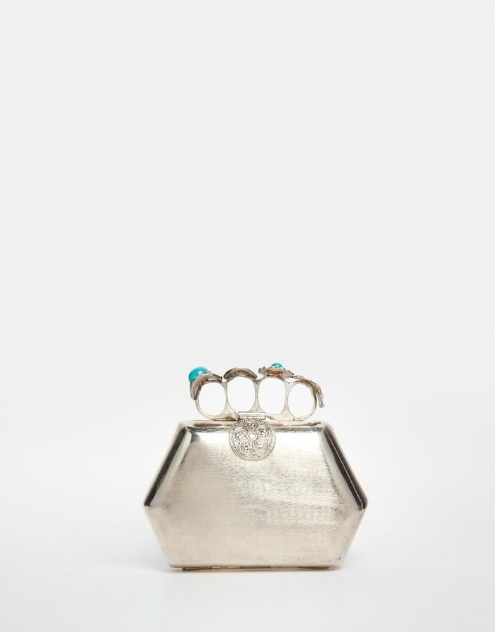 From St Xavier Exclusive Silver Clutch Bag with Turquoise Ring Detail ($89)