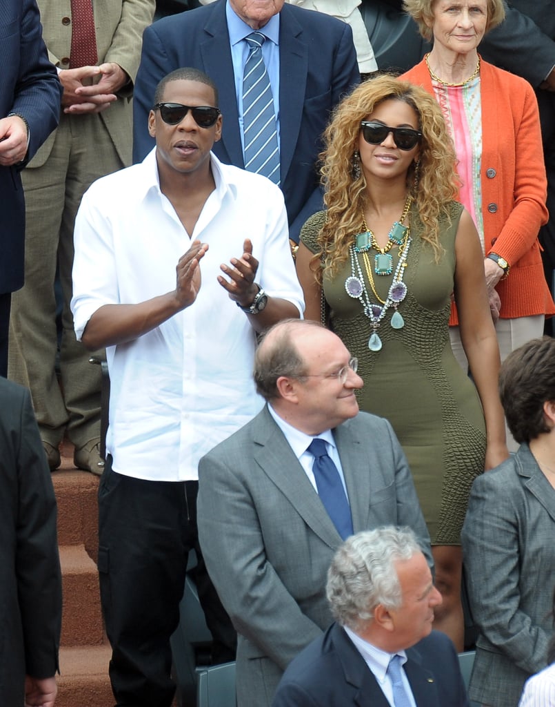 At the French Open in 2010, JAY-Z wore a crisp white collared shirt while Beyoncé dressed up an olive-green dress with a statement necklace.