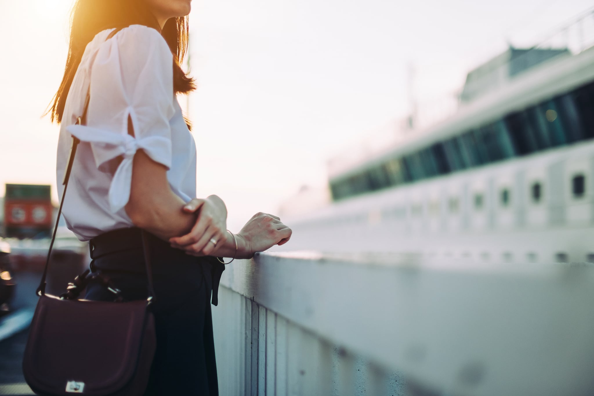 Young woman in cruise terminal waiting to get onboard