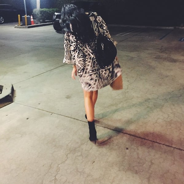 Kylie styled the oversize tee with pointed-toe booties.