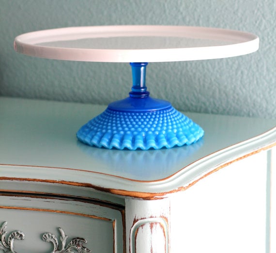 The shimmery shade of this Blue Glass Cake Stand (130) is so Unique
