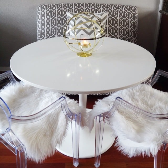 The finds the patterned bench, ghost chairs, and sheepskinstyle