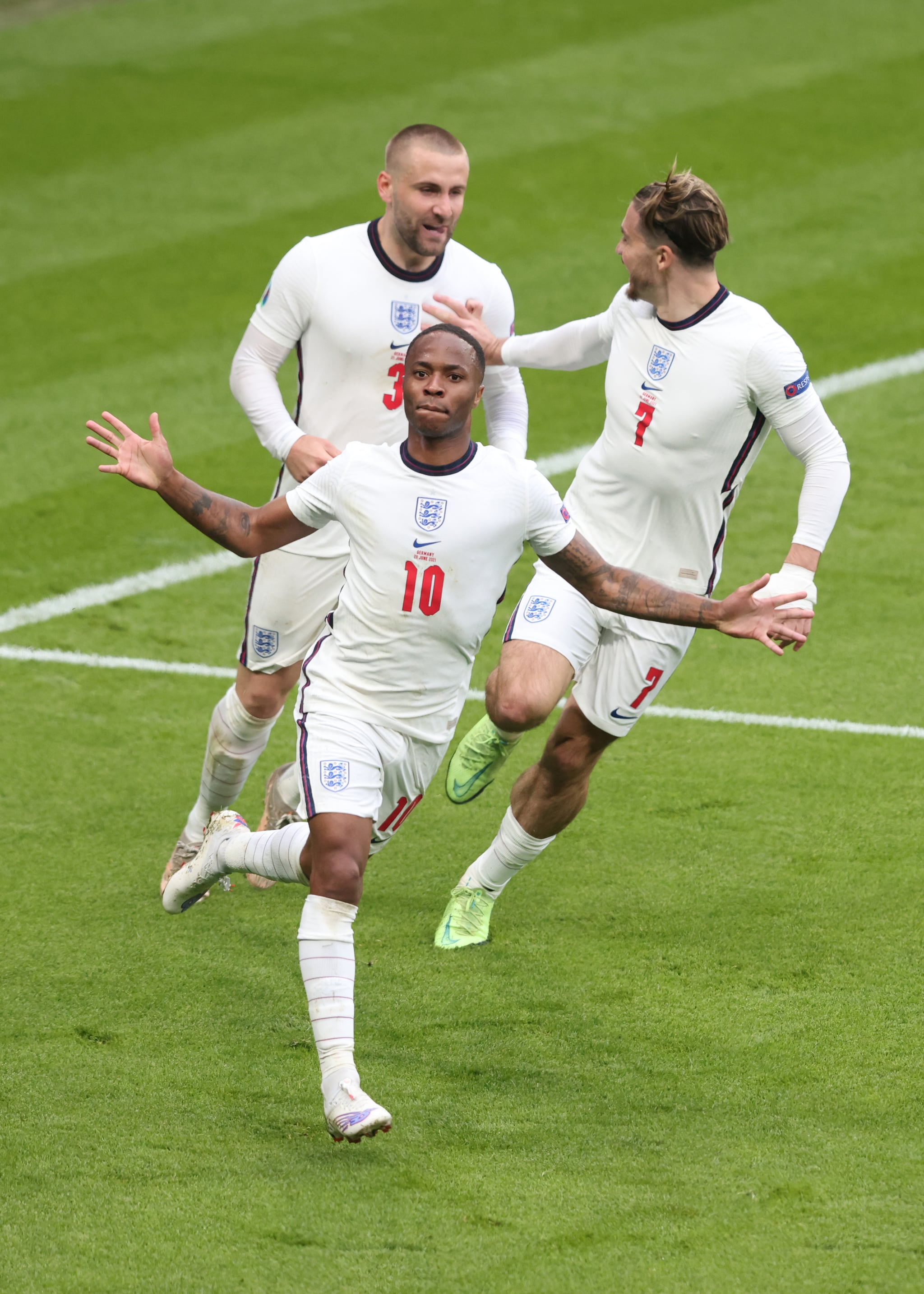 LONDON, ENGLAND - JUNE 29:  Raheem Sterling of England celebrates the opening goal with Jack Grealish and Luke Shaw during the UEFA Euro 2020 Championship Round of 16 match between England and Germany at Wembley Stadium on June 29, 2021 in London, United Kingdom. (Photo by Marc Atkins/Getty Images)