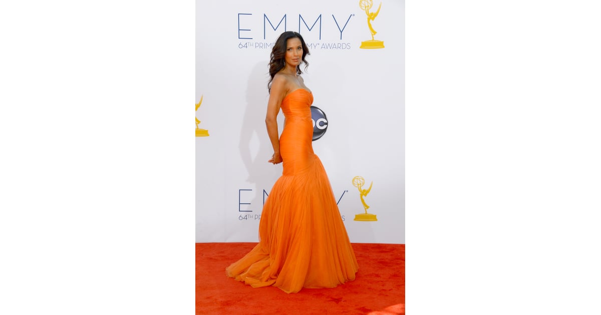 Top Chef host Padma Lakshmi rocked a bright orange dress on the red | Emmy Pictures 2012 ...