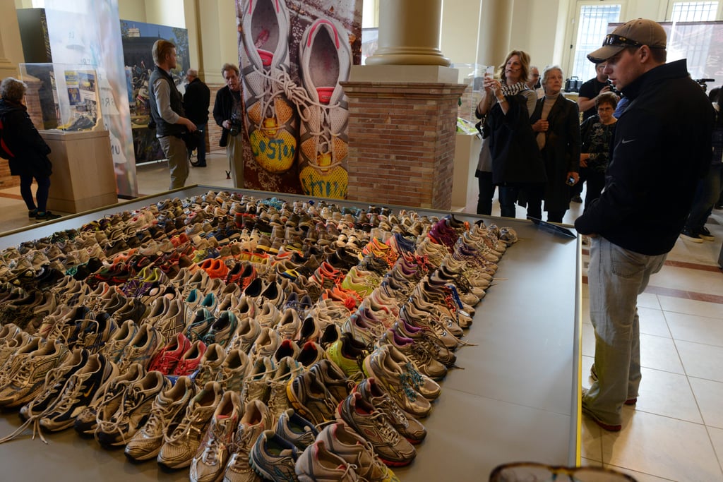 People attended the Boston Marathon memorial exhibition at the Boston Public Library ahead of the one-year anniversary of the bombing.